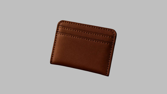 Brown leather cardholder on a white background