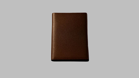 Brown leather wallet on a white background