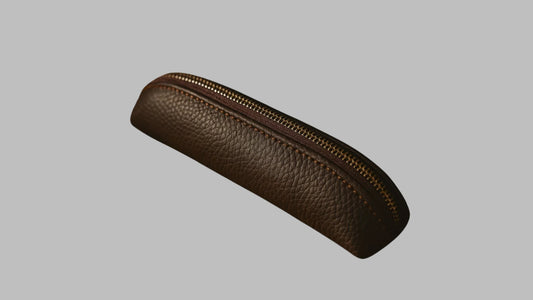 Brown leather pencil case with a zipper on a white background