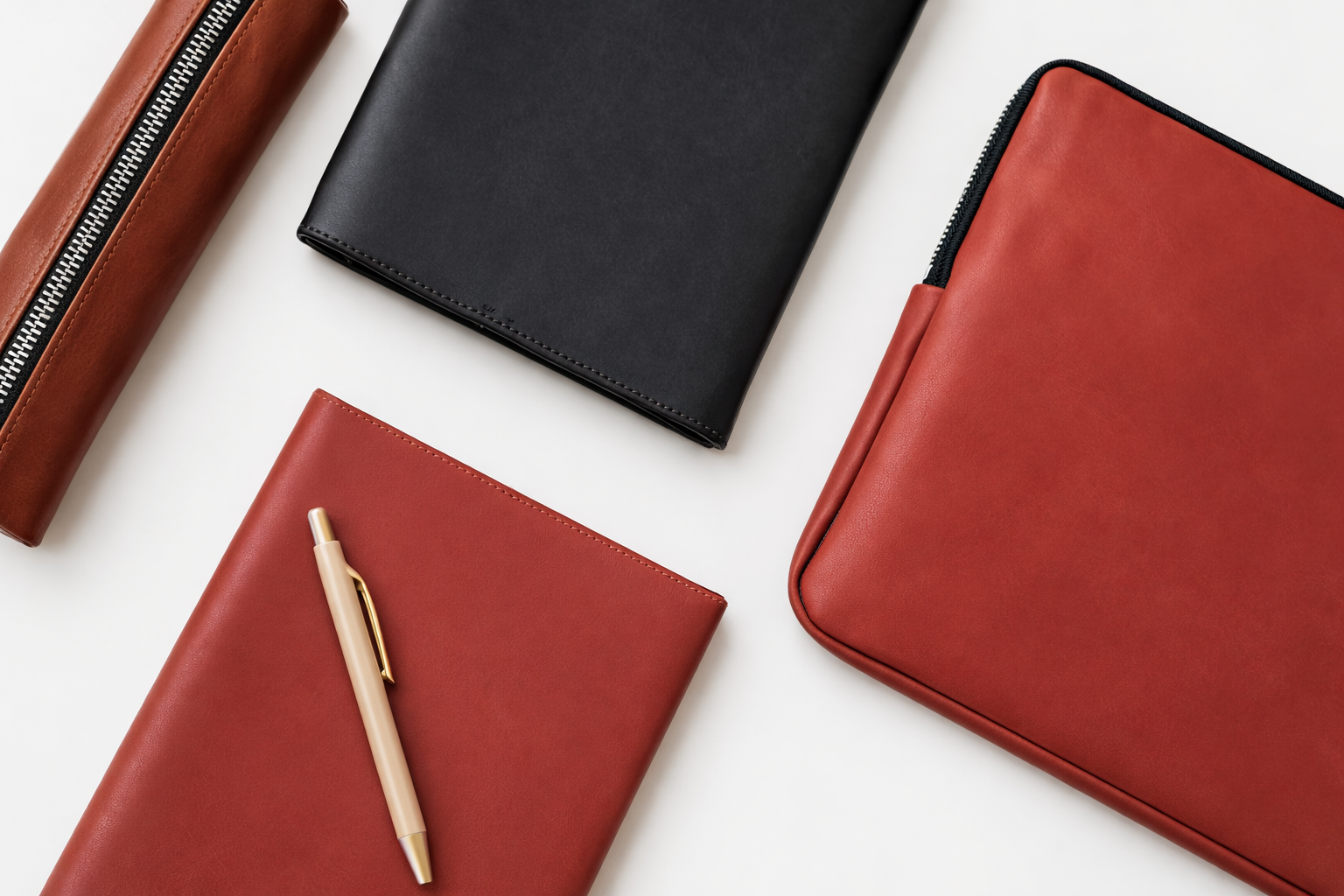ROND leather products including a notebook, laptopsleeve, and pencil case
