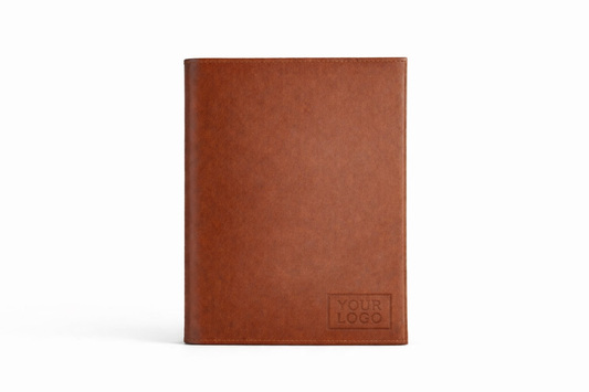 Brown leather notebook with a space for a logo on a white background
